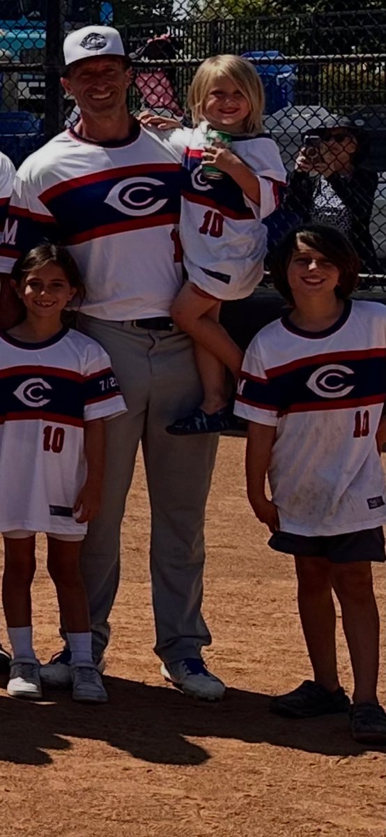 Coach Alex with his kids at the ballpark
